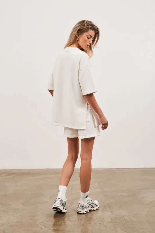 MINIMAL EMBLEM OVERSIZED T-SHIRT - OFF WHITE